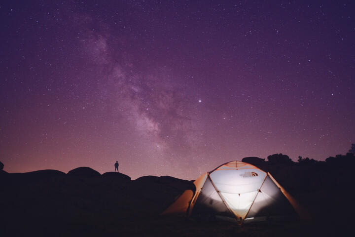 tent on the background of the milky way
